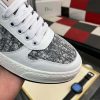 Diorsneaker_specificallyfeaturingagrayandwhitesnakeskin-likepatternonthesidepanels_6 Dior White Leather Grey Canvas Sneakers