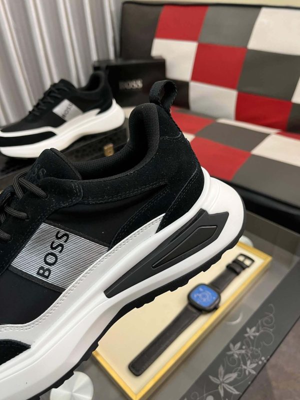 blackBOSSsneakerwithwhiteandgrayaccents_placedonablacktexturedsurface._3 BOSS Running-Inspired Trainers Black