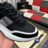 blackBOSSsneakerwithwhiteandgrayaccents_placedonablacktexturedsurface._6 BOSS Running-Inspired Trainers Black