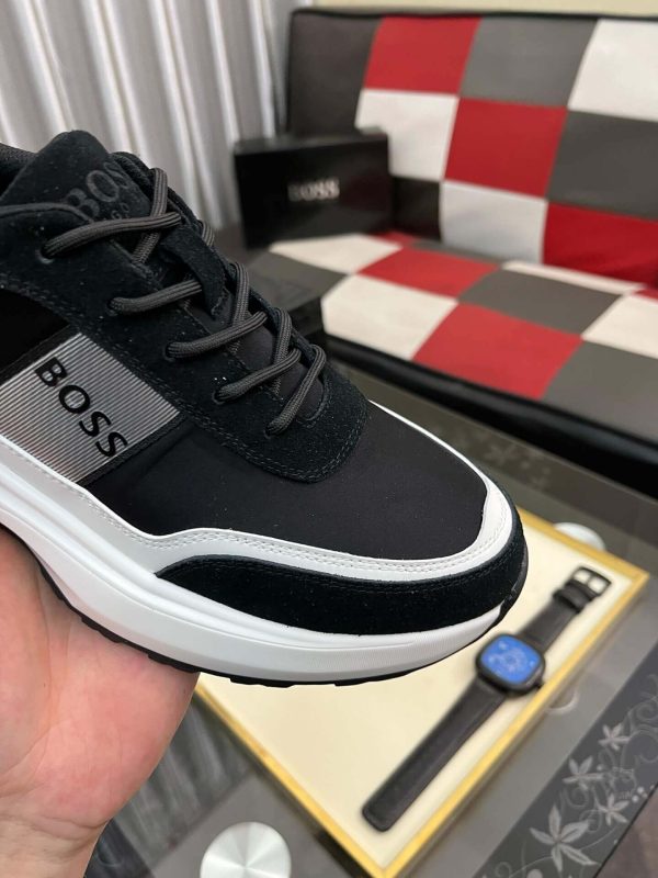 blackBOSSsneakerwithwhiteandgrayaccents_placedonablacktexturedsurface._6 BOSS Running-Inspired Trainers Black