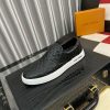 blackleatherLouisVuittonslip-onsneakerwithawhitesole_1 LV Black Monogram Embossed Leather Slip-On Trainers