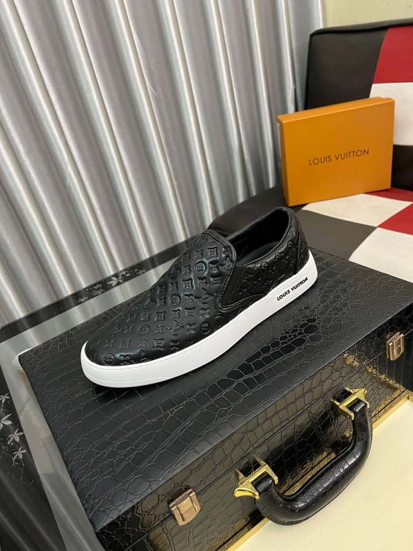 blackleatherLouisVuittonslip-onsneakerwithawhitesole_1 LV Black Monogram Embossed Leather Slip-On Trainers