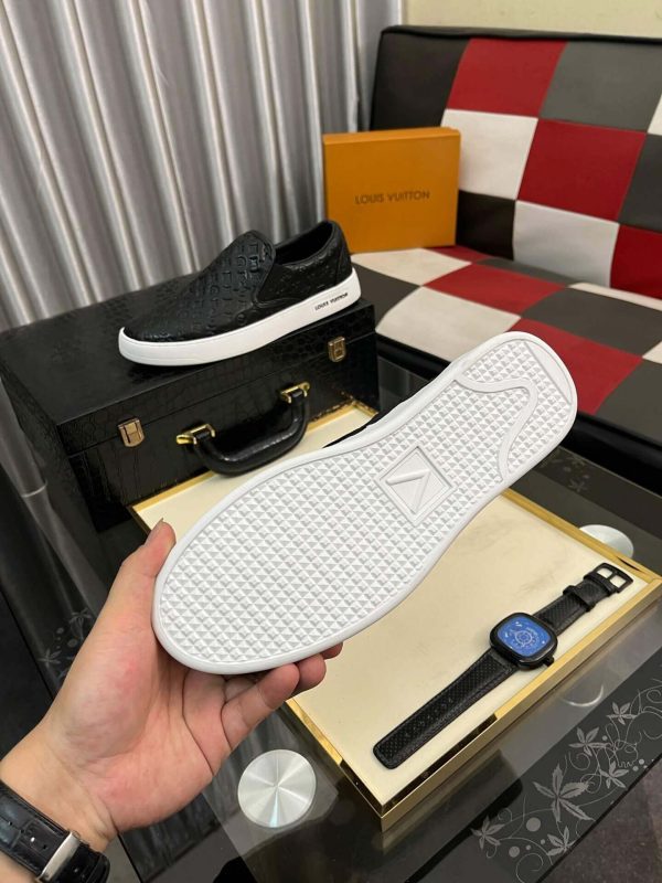 blackleatherLouisVuittonslip-onsneakerwithawhitesole_2 LV Black Monogram Embossed Leather Slip-On Trainers