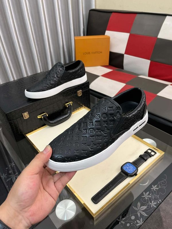 blackleatherLouisVuittonslip-onsneakerwithawhitesole_5 LV Black Monogram Embossed Leather Slip-On Trainers