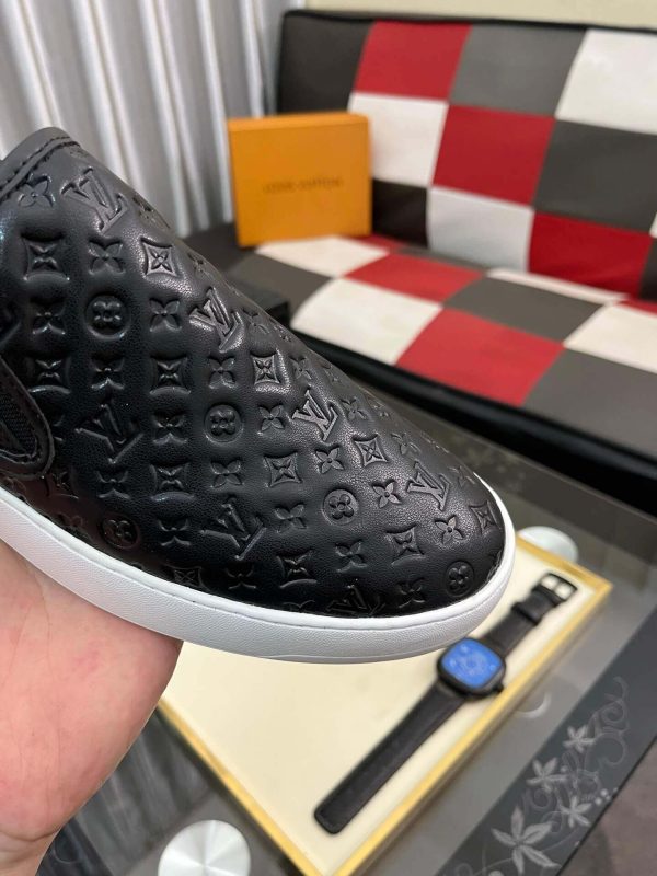 blackleatherLouisVuittonslip-onsneakerwithawhitesole_6 LV Black Monogram Embossed Leather Slip-On Trainers