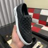 blackleatherLouisVuittonslip-onsneakerwithawhitesole_7 LV Black Monogram Embossed Leather Slip-On Trainers