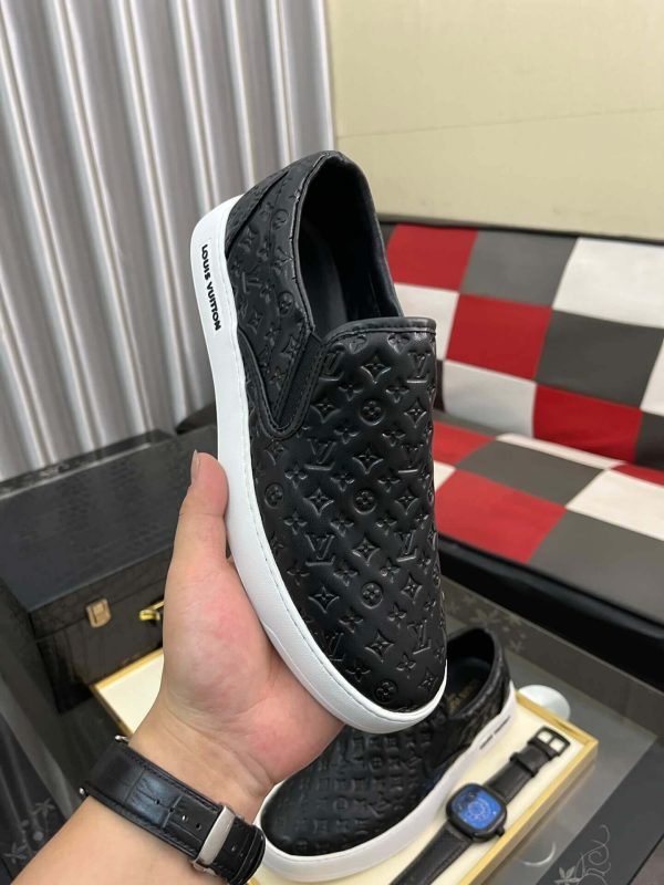 blackleatherLouisVuittonslip-onsneakerwithawhitesole_7 LV Black Monogram Embossed Leather Slip-On Trainers