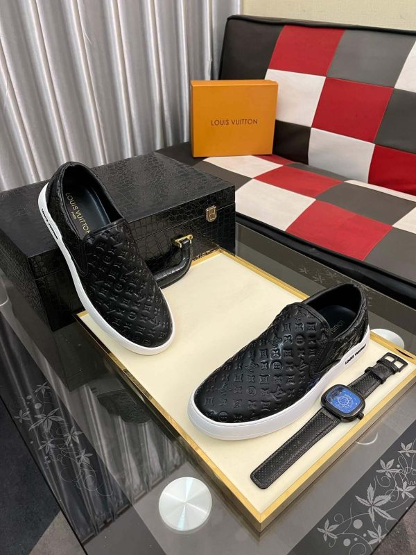 blackleatherLouisVuittonslip-onsneakerwithawhitesole_8 LV Black Monogram Embossed Leather Slip-On Trainers