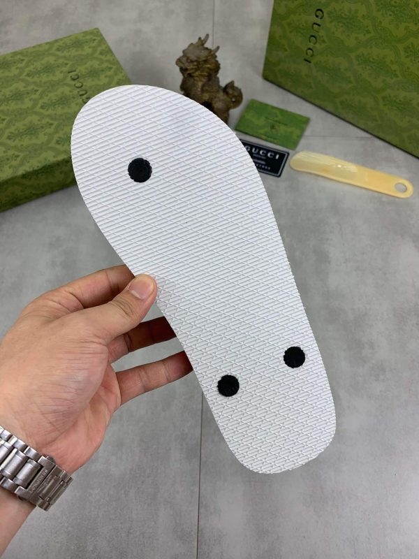 lightgreensoleadornedwiththeiconicinterlockingGGlogopatternandblackstrapswithaprominentGGemblematthecenter_7 Gucci Green Interlocking Jacquard Thong Sandals with Double G