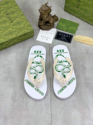 whiteGucciflip-flopwithagreensnakedesignandthephrasesGUCCIFYYOURSELFandSPROVVEDUTAETA_XXV._10 Gucci Sprovveduta Eta' XXV Thong Sandals with Double G