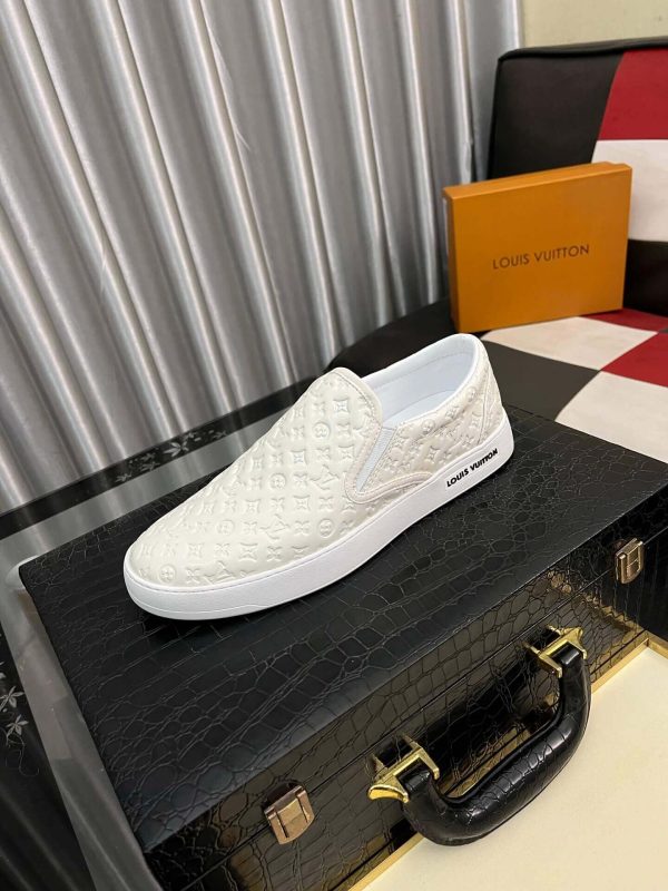 whiteLouisVuittonslip-onsneakerwiththebrand_smonogrampatternembossedacrosstheupper_1 LV Men's White Monogram Embossed Leather Slip-On Trainers