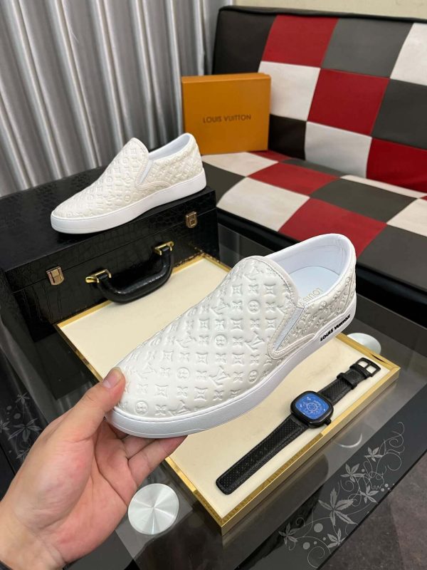 whiteLouisVuittonslip-onsneakerwiththebrand_smonogrampatternembossedacrosstheupper_6 LV Men's White Monogram Embossed Leather Slip-On Trainers