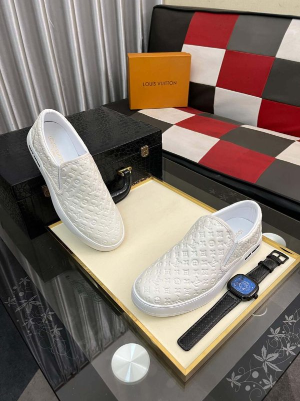 whiteLouisVuittonslip-onsneakerwiththebrand_smonogrampatternembossedacrosstheupper_8 LV Men's White Monogram Embossed Leather Slip-On Trainers
