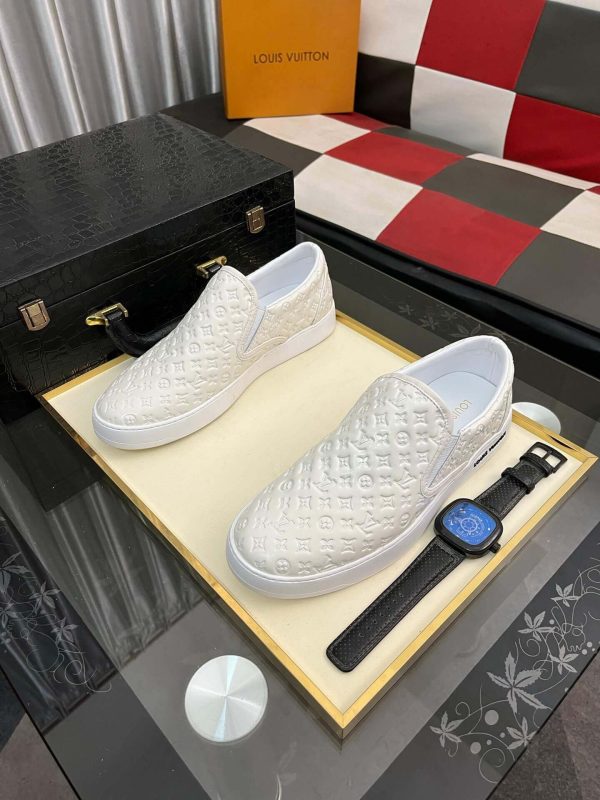 whiteLouisVuittonslip-onsneakerwiththebrand_smonogrampatternembossedacrosstheupper_9 LV Men's White Monogram Embossed Leather Slip-On Trainers
