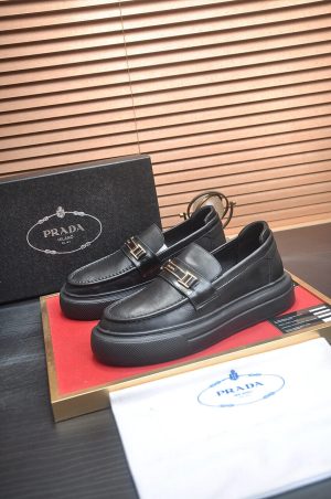 Prada Black Brushed Leather Platform Loafers with Gold-Tone Signature