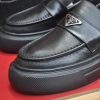 Prada Black Brushed Leather Platform Loafers with Enamel Triangle Logo