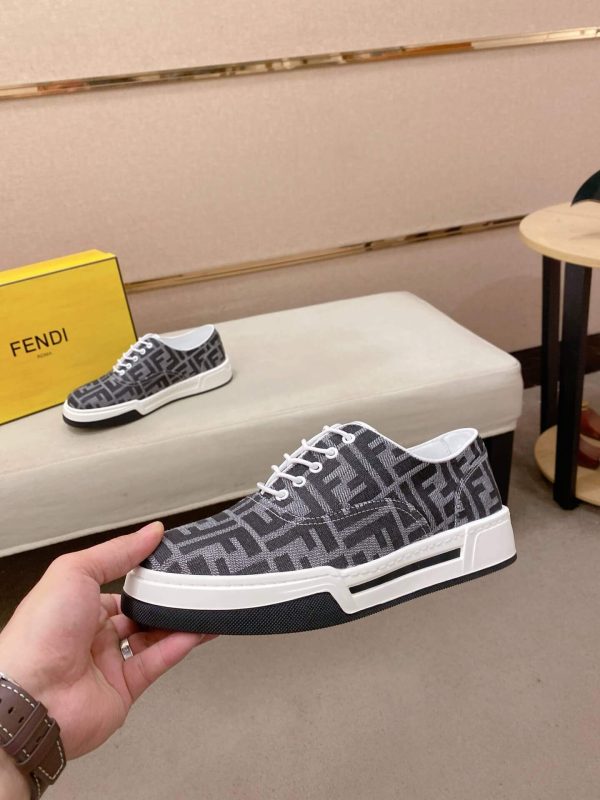 FendiFlowsneakersorasimilarlow-toplace-upstylefeaturingthesignatureFFmotif._1 Black & White Fendi Flow Sneaker low-top lace-up style featuring the signature FF motif.