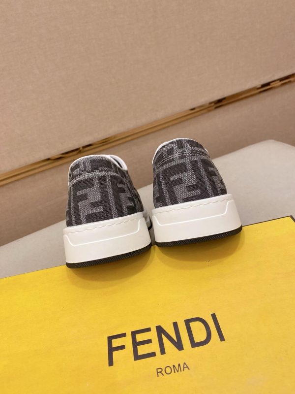 FendiFlowsneakersorasimilarlow-toplace-upstylefeaturingthesignatureFFmotif._3 Black & White Fendi Flow Sneaker low-top lace-up style featuring the signature FF motif.