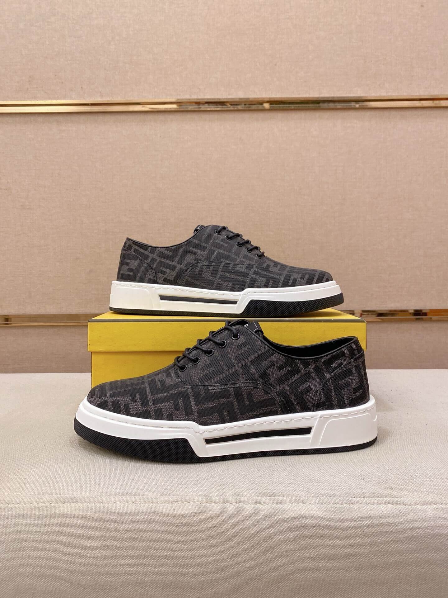 Black & White Fendi Flow Sneaker or a similar low-top lace-up style featuring the signature FF motif. 1 Black & White Fendi Flow Sneaker or a similar low-top lace-up style featuring the signature FF motif.
