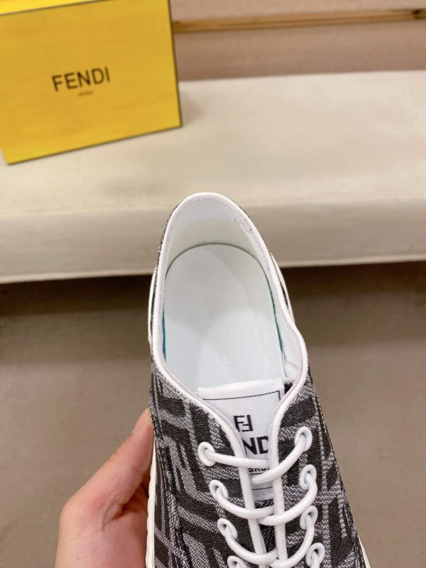 FendiFlowsneakersorasimilarlow-toplace-upstylefeaturingthesignatureFFmotif._5 Black & White Fendi Flow Sneaker low-top lace-up style featuring the signature FF motif.