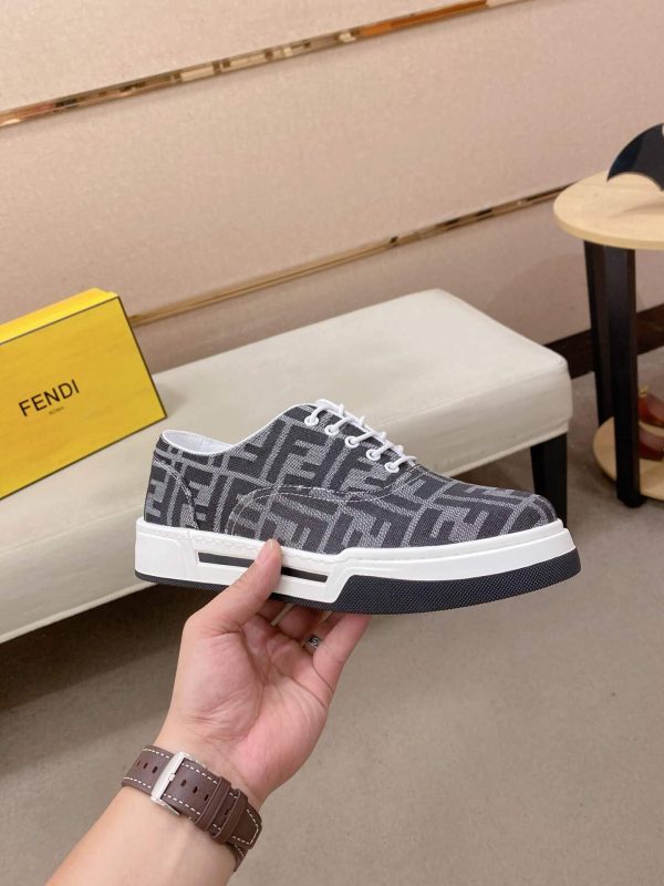 FendiFlowsneakersorasimilarlow-toplace-upstylefeaturingthesignatureFFmotif._7 Black & White Fendi Flow Sneaker low-top lace-up style featuring the signature FF motif.