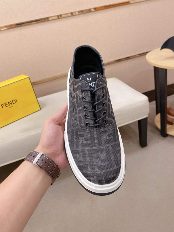 Black & White Fendi Flow Sneaker or a similar low-top lace-up style featuring the signature FF motif.