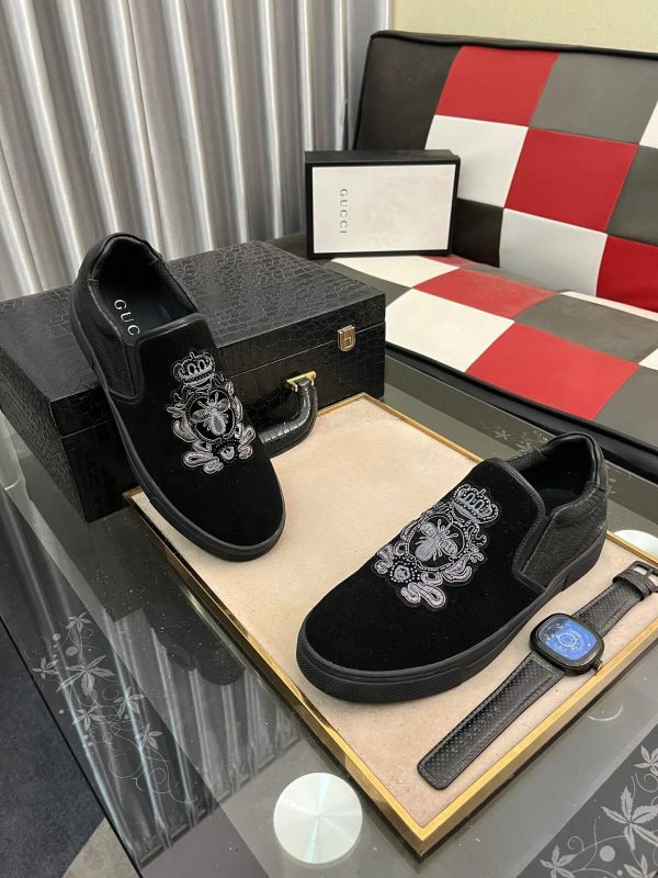 Gucci Men's Slip-On Loafers with An Embellished Crest Design.