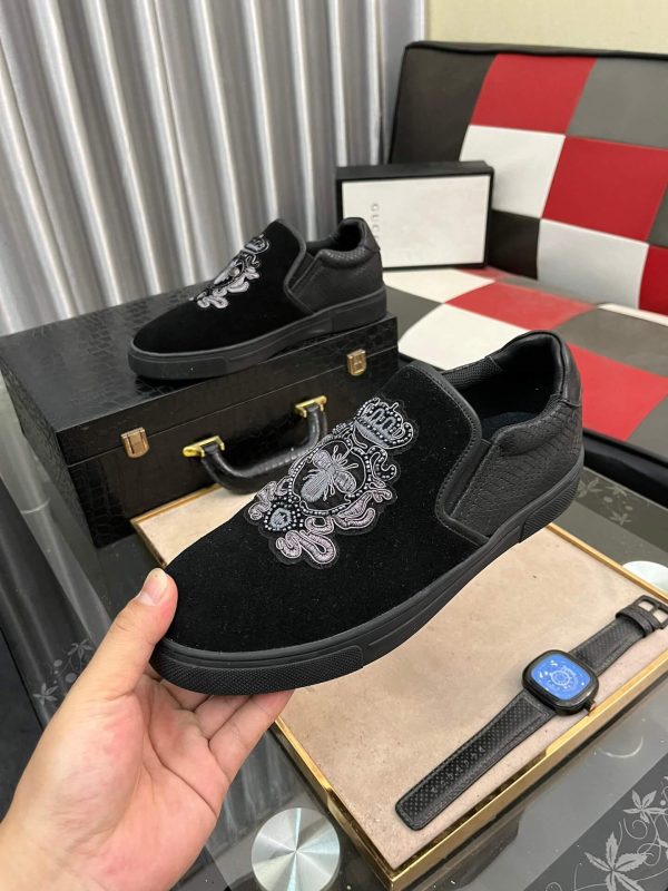 Gucci Men's Slip-On Loafers with An Embellished Crest Design.