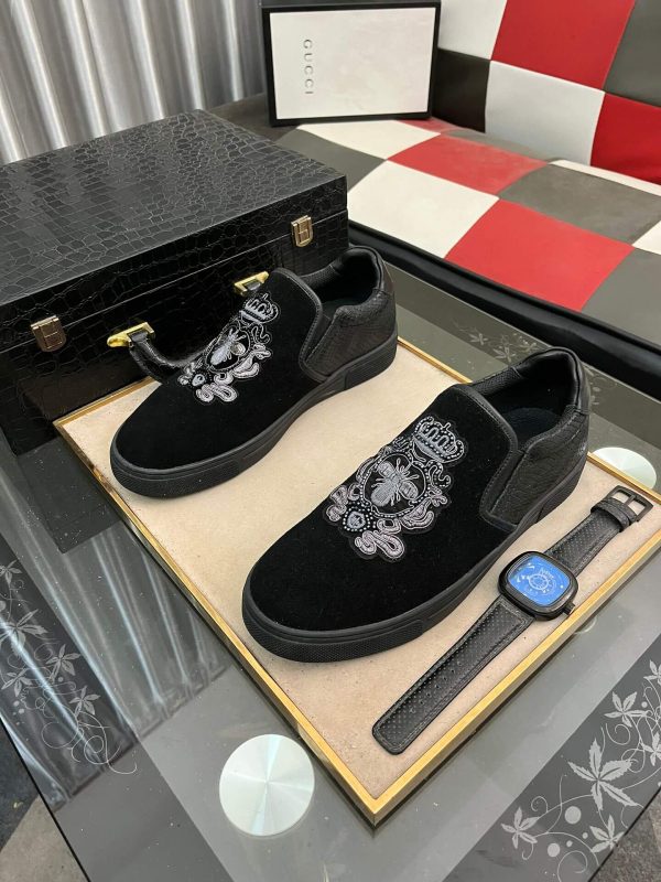 Gucci Men's Slip-On Loafers with An Embellished Crest Design.