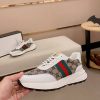 GucciNansneakerfeaturingthebrand_ssignatureGGmonogramcanvas_1 Gucci Brown GG Canvas and White Leather Re-Motion Sneaker