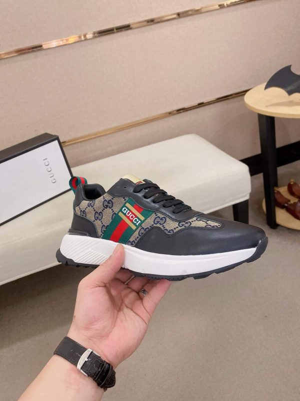 GucciRhytonsneakerfeaturingthebrand_ssignatureGGmotifandredandgreenwebstripe._1 Gucci Trainer in Blue and Beige Supreme Canvas and Black Leather