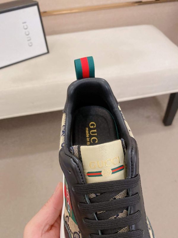 GucciRhytonsneakerfeaturingthebrand_ssignatureGGmotifandredandgreenwebstripe._3 (1) Gucci Trainer in Blue and Beige Supreme Canvas and Black Leather
