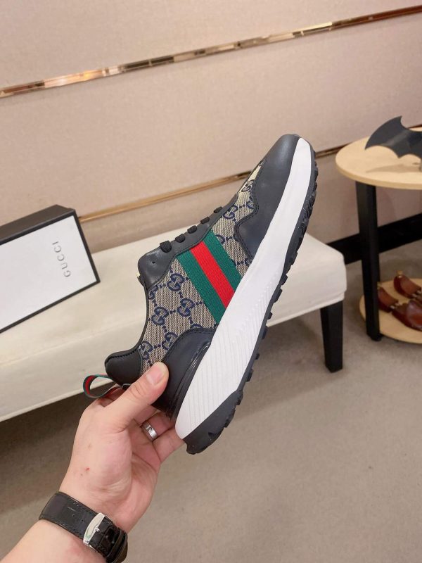 GucciRhytonsneakerfeaturingthebrand_ssignatureGGmotifandredandgreenwebstripe._3 Gucci Trainer in Blue and Beige Supreme Canvas and Black Leather