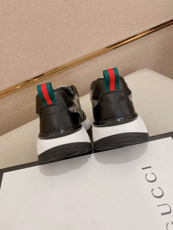 GucciRhytonsneakerfeaturingthebrand_ssignatureGGmotifandredandgreenwebstripe._5 Gucci Trainer in Blue and Beige Supreme Canvas and Black Leather