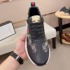 GucciRhytonsneakerfeaturingthebrand_ssignatureGGmotifandredandgreenwebstripe._7 Gucci Trainer in Blue and Beige Supreme Canvas and Black Leather
