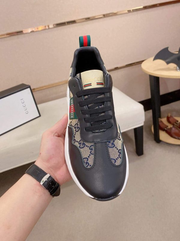 GucciRhytonsneakerfeaturingthebrand_ssignatureGGmotifandredandgreenwebstripe._7 Gucci Trainer in Blue and Beige Supreme Canvas and Black Leather
