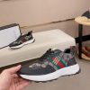GucciRhytonsneakerfeaturingthebrand_ssignatureGGmotifandredandgreenwebstripe._8 (1) Gucci Trainer in Blue and Beige Supreme Canvas and Black Leather