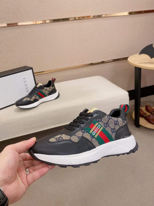 GucciRhytonsneakerfeaturingthebrand_ssignatureGGmotifandredandgreenwebstripe._8 (1) Gucci Trainer in Blue and Beige Supreme Canvas and Black Leather