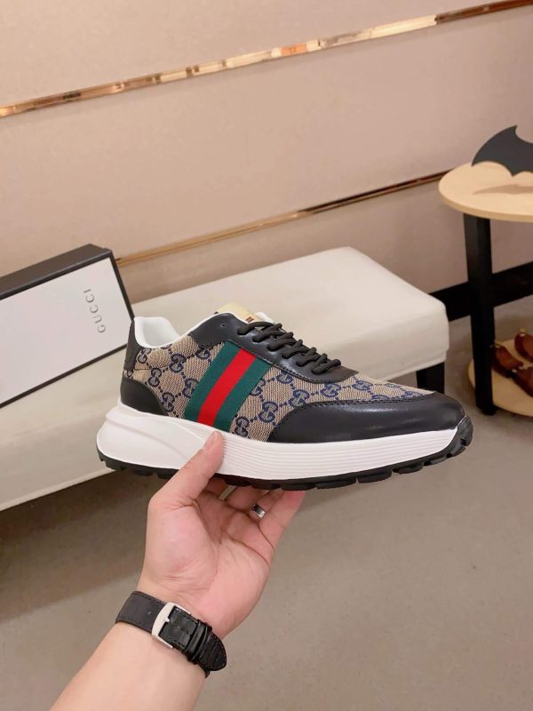 Guccisneakerfeaturingthebrand_siconicGGmonogramcanvas_withagreenandredwebstripeontheside._8 Gucci Blue Brown GG Canvas Re-Motion Trainers