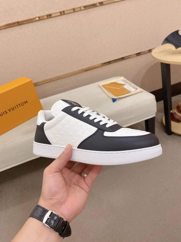 LOUIS VUITTON Rivoli Sneaker in White Monogram Debossed Leather and Black Smooth Leather