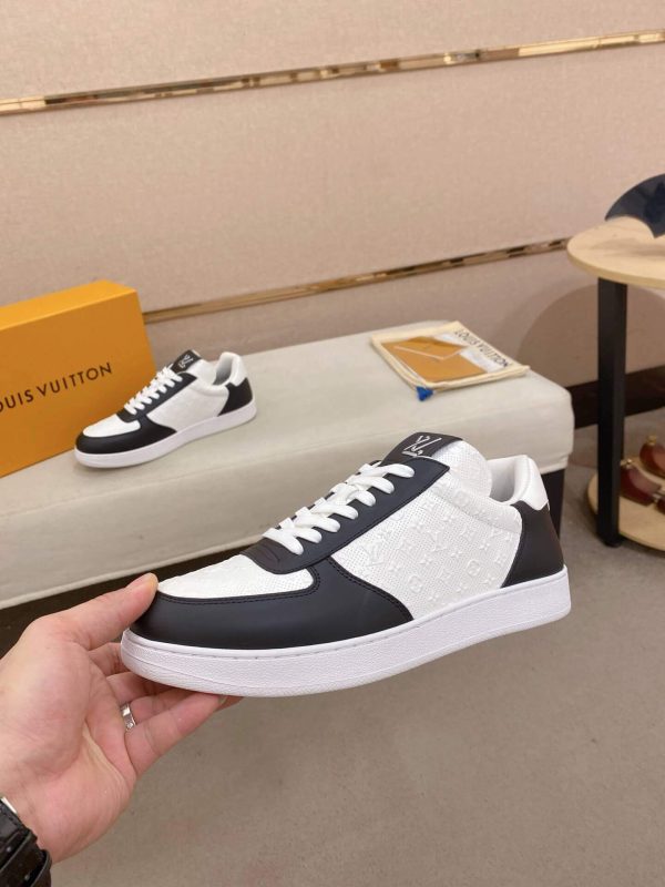 LOUIS VUITTON Rivoli Sneaker in White Monogram Debossed Leather and Black Smooth Leather