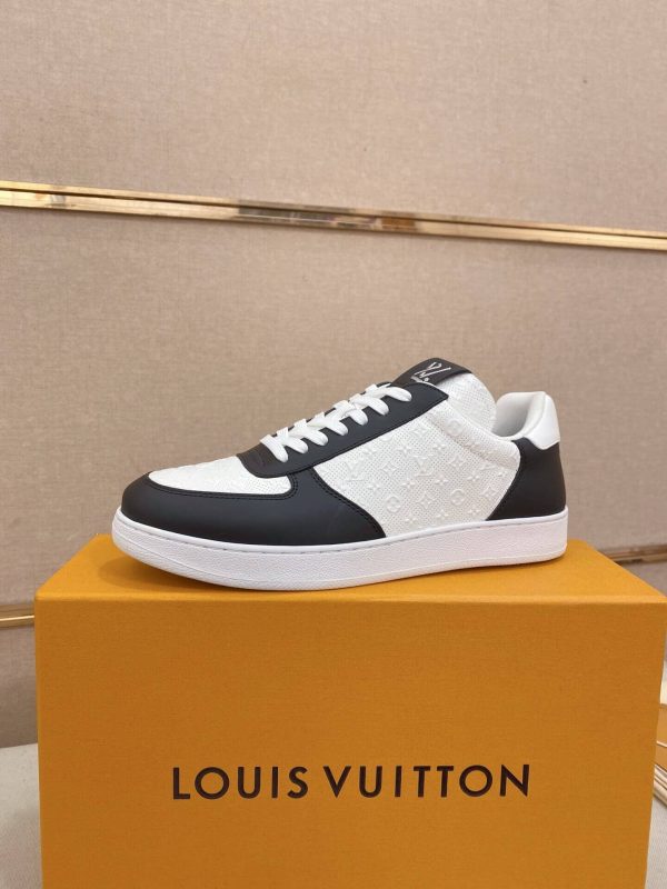 LOUIS VUITTON Rivoli Sneaker in White Monogram Debossed Leather and Black Smooth Leather