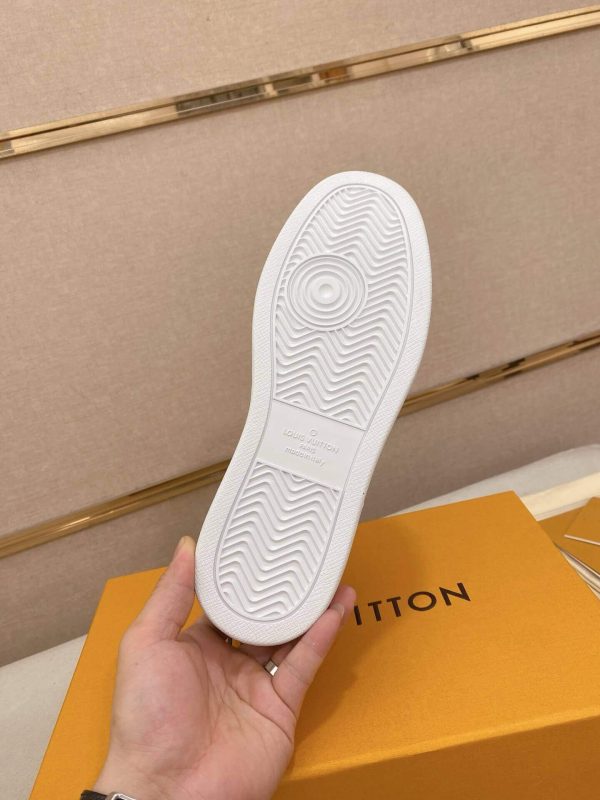 LOUIS VUITTON Rivoli Sneaker in White Monogram Debossed Leather and Black Smooth Leather