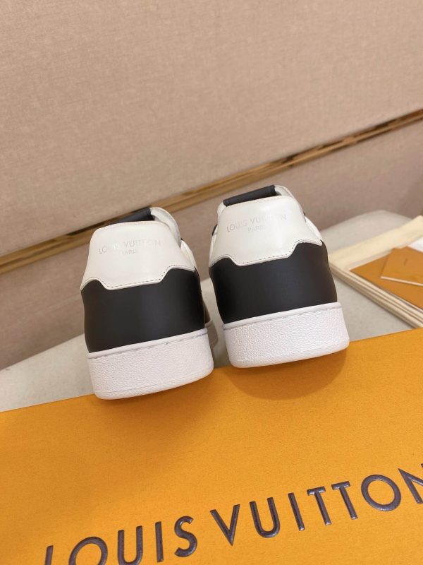 LOUIS VUITTON Rivoli Sneaker in White Monogram Debossed Leather and Black Smooth Leather