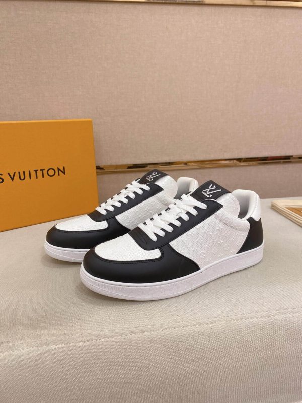 LOUIS VUITTON Rivoli Sneaker in White Monogram Debossed Leather and Black Smooth Leather