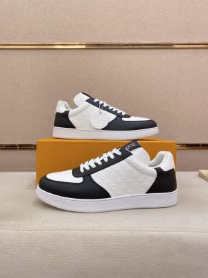 LOUIS VUITTON Rivoli Sneaker in White Monogram Debossed Leather and Black Smooth Leather