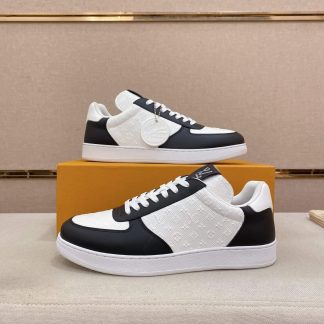 LOUIS VUITTON Rivoli Sneaker in White Monogram Debossed Leather and Black Smooth Leather