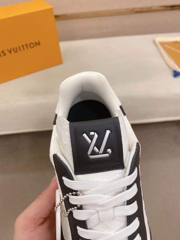 LOUIS VUITTON Rivoli Sneaker in White Monogram Debossed Leather and Black Smooth Leather