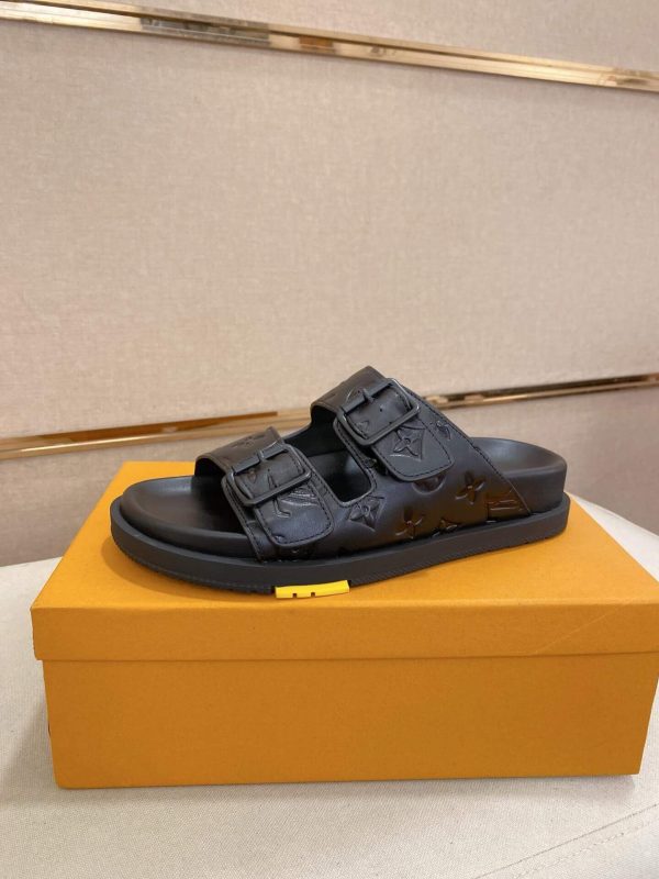 LouisVuittonslidesandals_featuringthebrand_ssignaturemonogrampatternonthestraps_2_ca70a7e8-f675-4a56-9636-1d25199a1856 LV Venice Mule in Black Monogram Embossed Leather