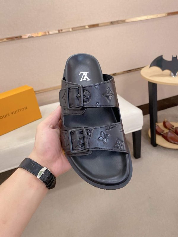 LouisVuittonslidesandals_featuringthebrand_ssignaturemonogrampatternonthestraps_3_d1484de0-ed78-47a7-935d-43d29494a57e LV Venice Mule in Black Monogram Embossed Leather